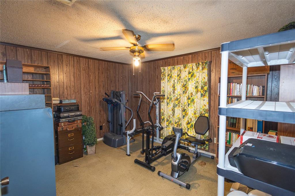809 Lomo Street Fort Worth, TX 76110 - Photo 23 of 31 a view of a room with gym equipment