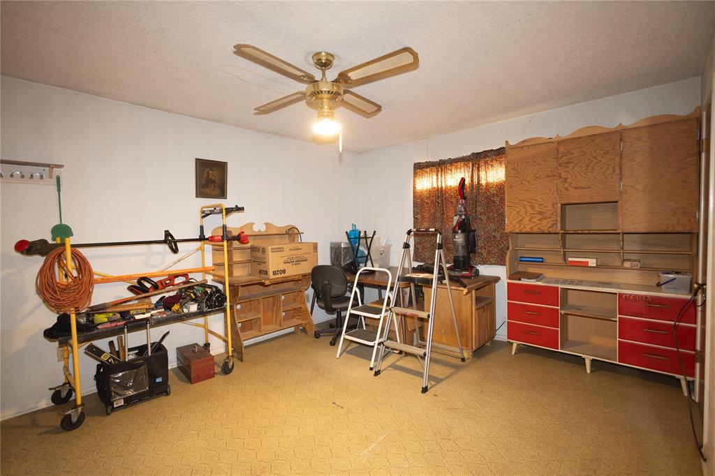 809 Lomo Street Fort Worth, TX 76110 - Photo 27 of 31 a view of a room with gym equipment
