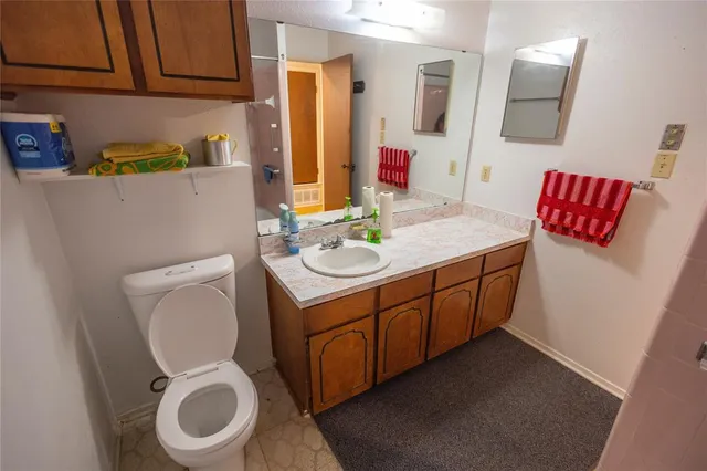 a kitchen with refrigerator and window