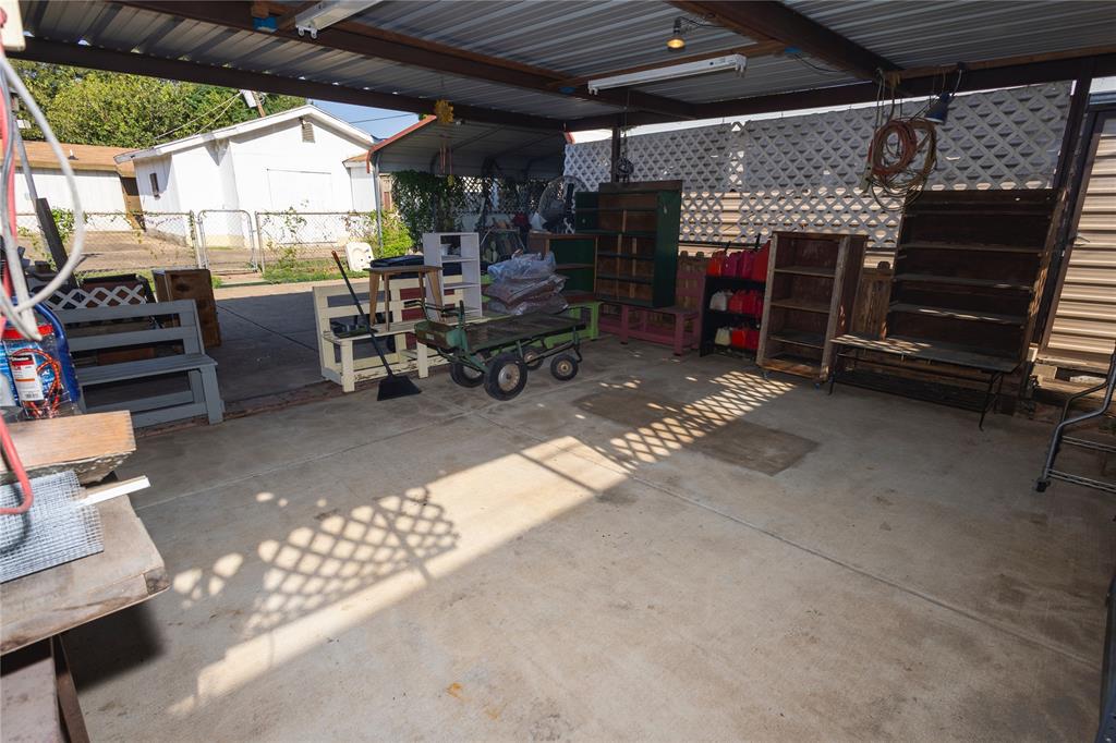 809 Lomo Street Fort Worth, TX 76110 - Photo 5 of 31 a view of a garage with chairs