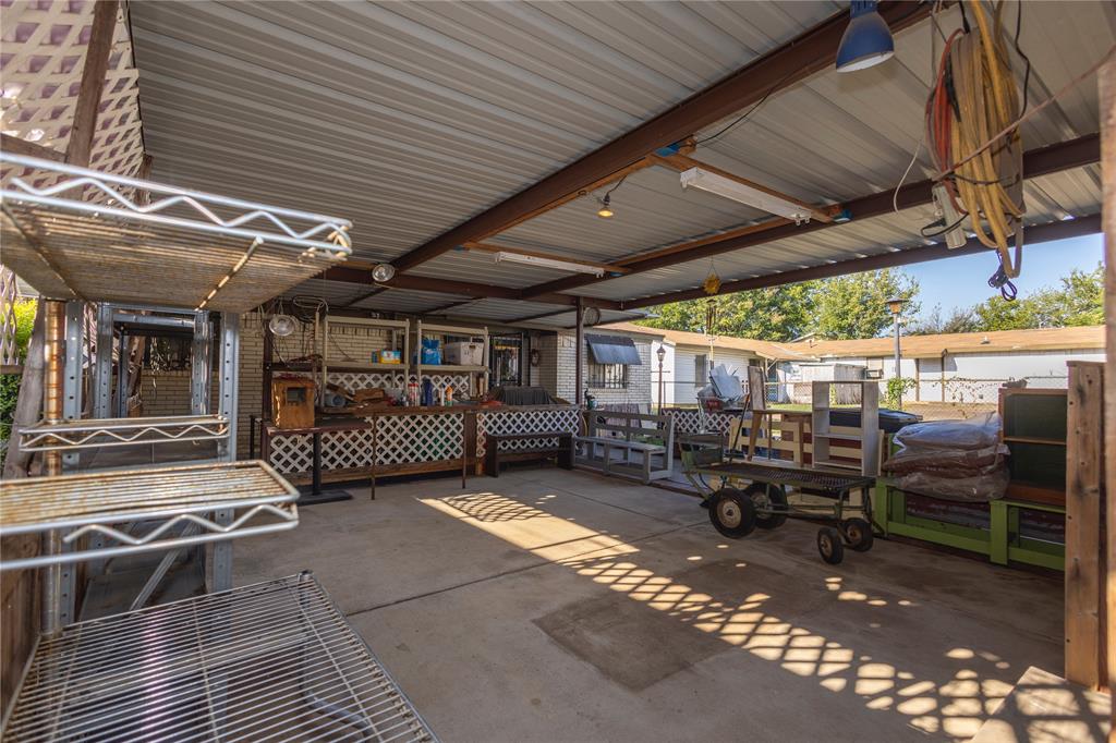 809 Lomo Street Fort Worth, TX 76110 - Photo 7 of 31 a view of a garage with chairs