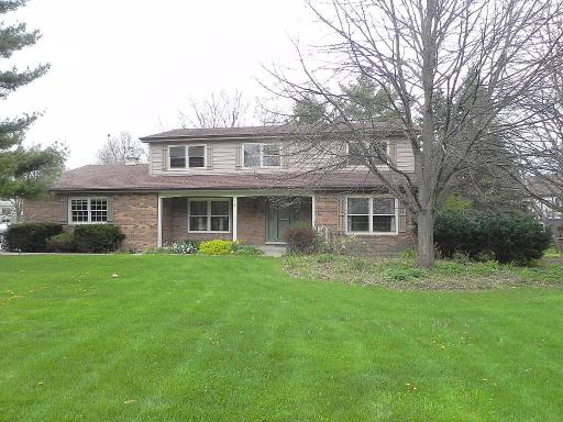 5N485 Oak Road St. Charles, IL 60175 - Photo 1 of 16 a front view of a house with a yard