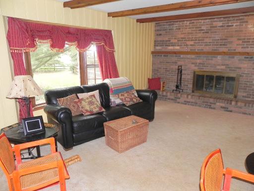 5N485 Oak Road St. Charles, IL 60175 - Photo 11 of 16 a living room with furniture and a fireplace