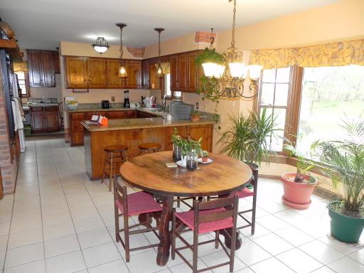 5N485 Oak Road St. Charles, IL 60175 - Photo 6 of 16 a dining room filled with furniture and a large window