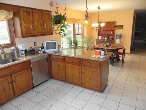 5N485 Oak Road St. Charles, IL 60175 - Photo 9 of 16 a kitchen with a sink and cabinets