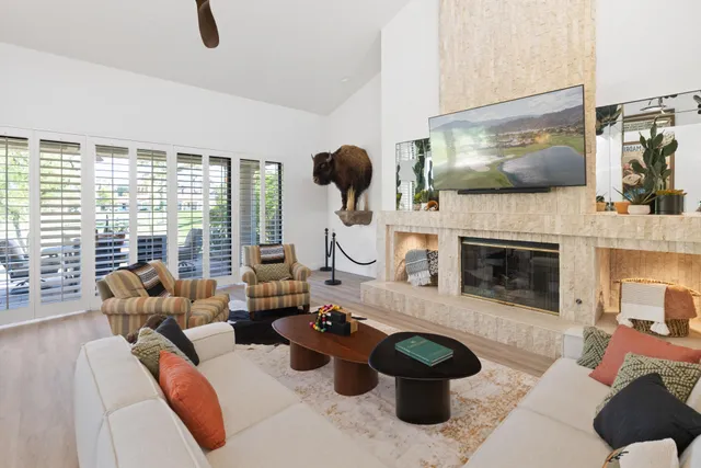 a living room with furniture and a fireplace