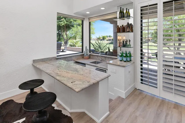 a kitchen with a table and chairs in it