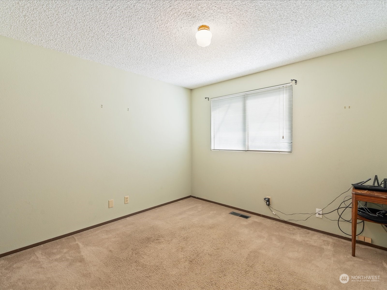 22211 49th Avenue Southeast Bothell, WA 98021 - Photo 18 of 37 an empty room with a workbench