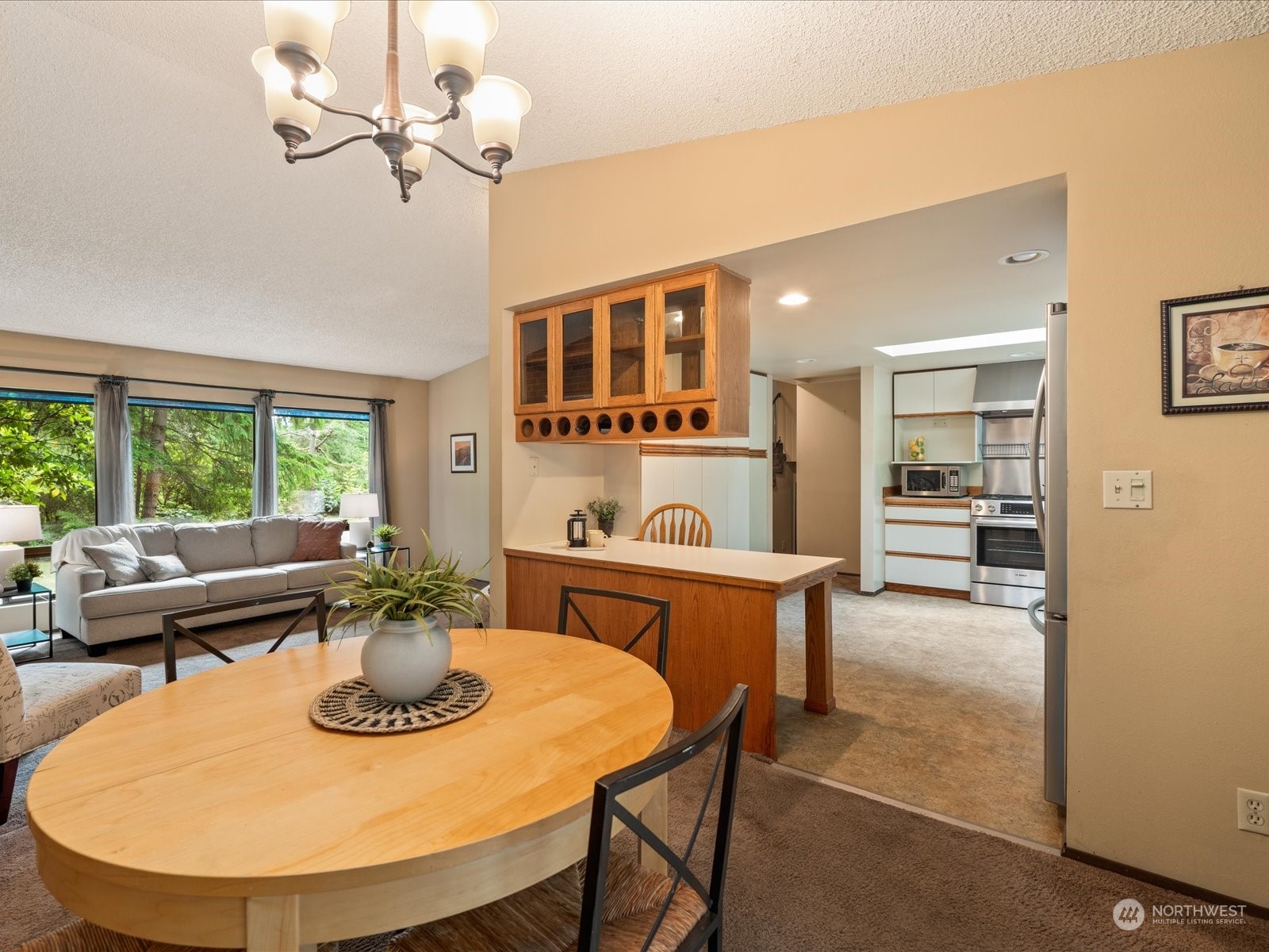 22211 49th Avenue Southeast Bothell, WA 98021 - Photo 10 of 37 a view of a dining room with furniture window and outside view