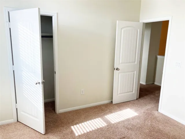 a view of a room that has a window in it