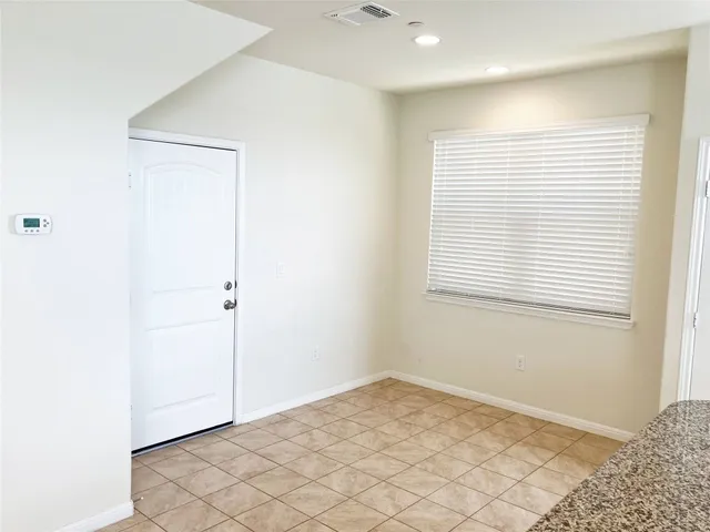 a view of an empty room and window