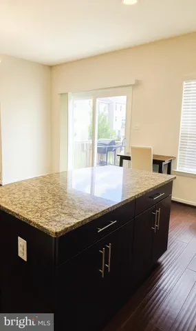 a view of a balcony with wooden floor
