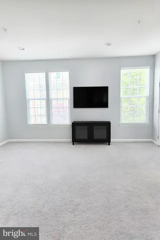a view of a livingroom with wooden floor