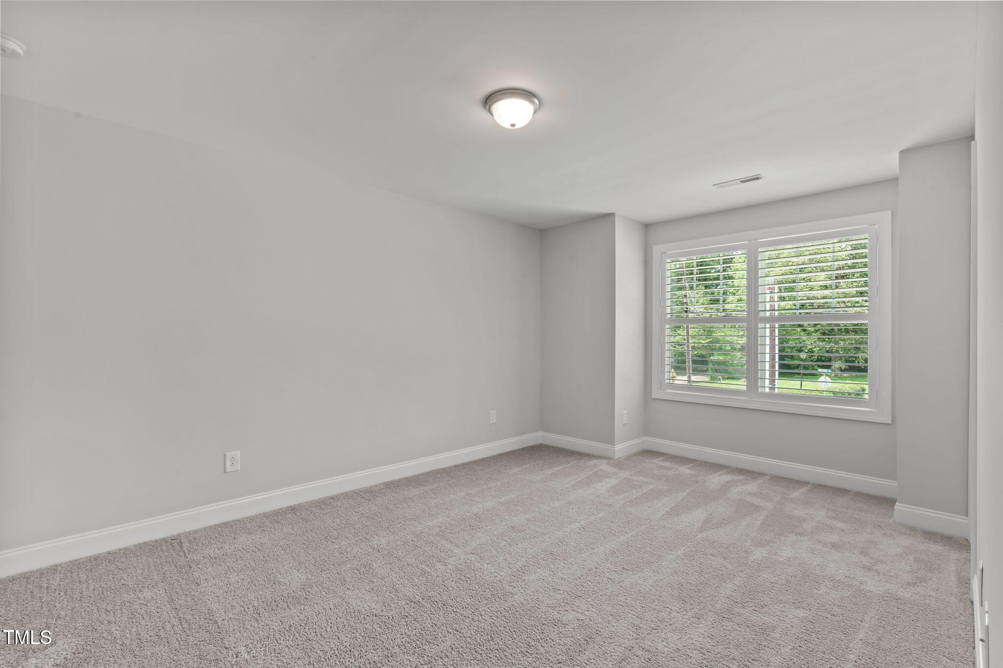 409 Morreene Road Durham, NC 27705 - Photo 23 of 30 an empty room with a window