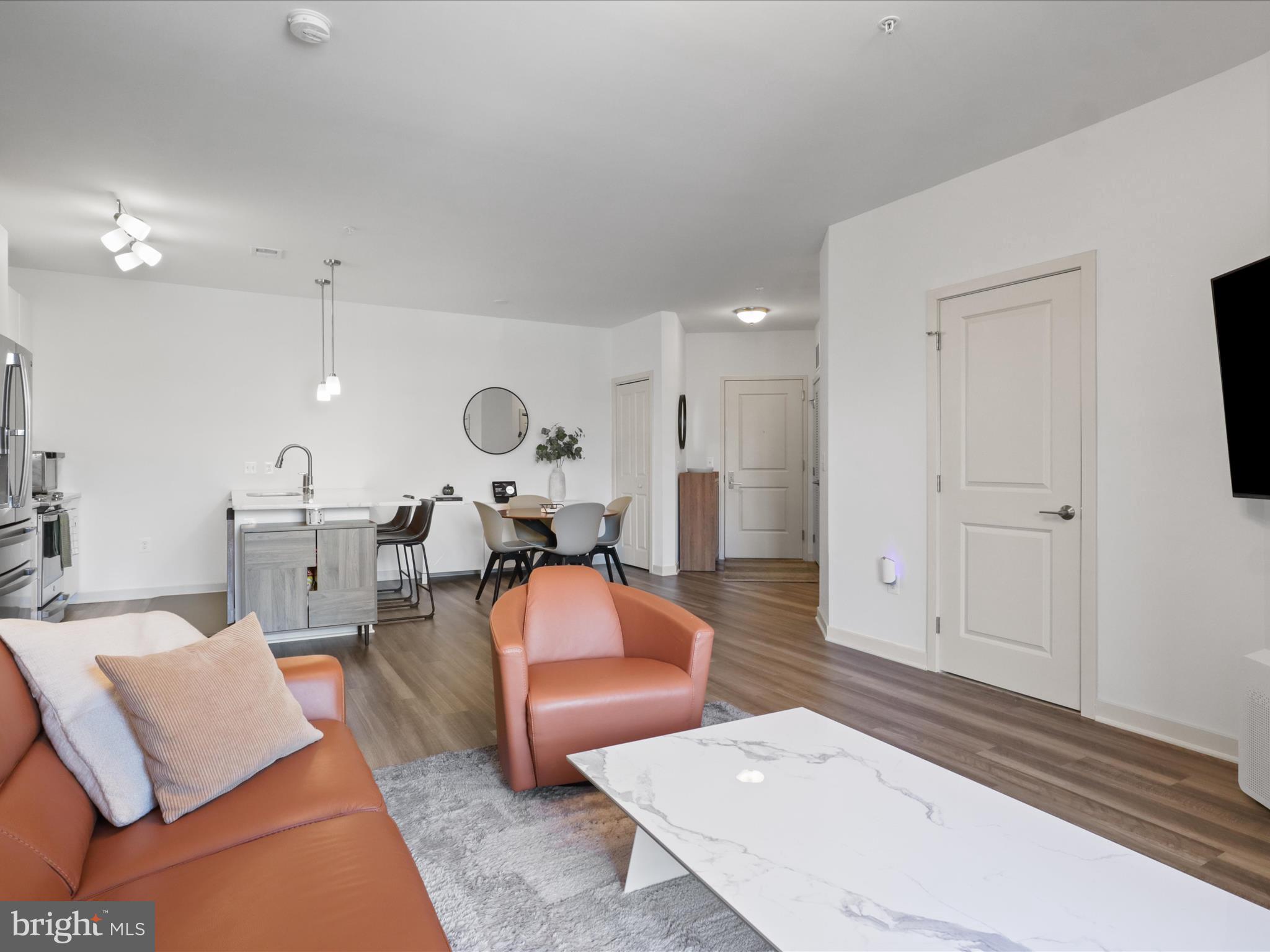 10755 Fairgrounds Drive, Unit 223 Fairfax, VA 22030 - Photo 14 of 28 a living room with furniture a rug and white walls