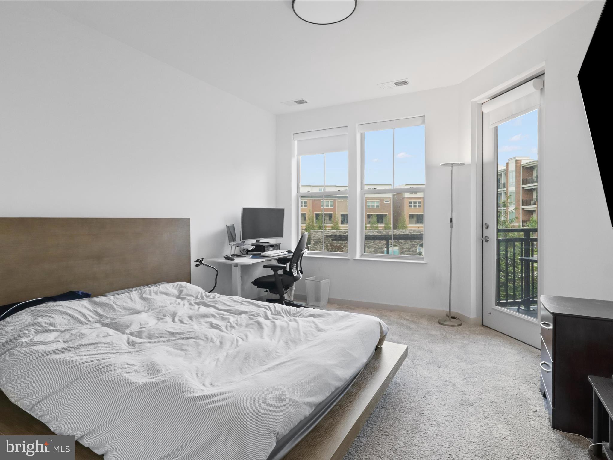 10755 Fairgrounds Drive, Unit 223 Fairfax, VA 22030 - Photo 16 of 28 a bed sitting in a spacious bedroom next to a window