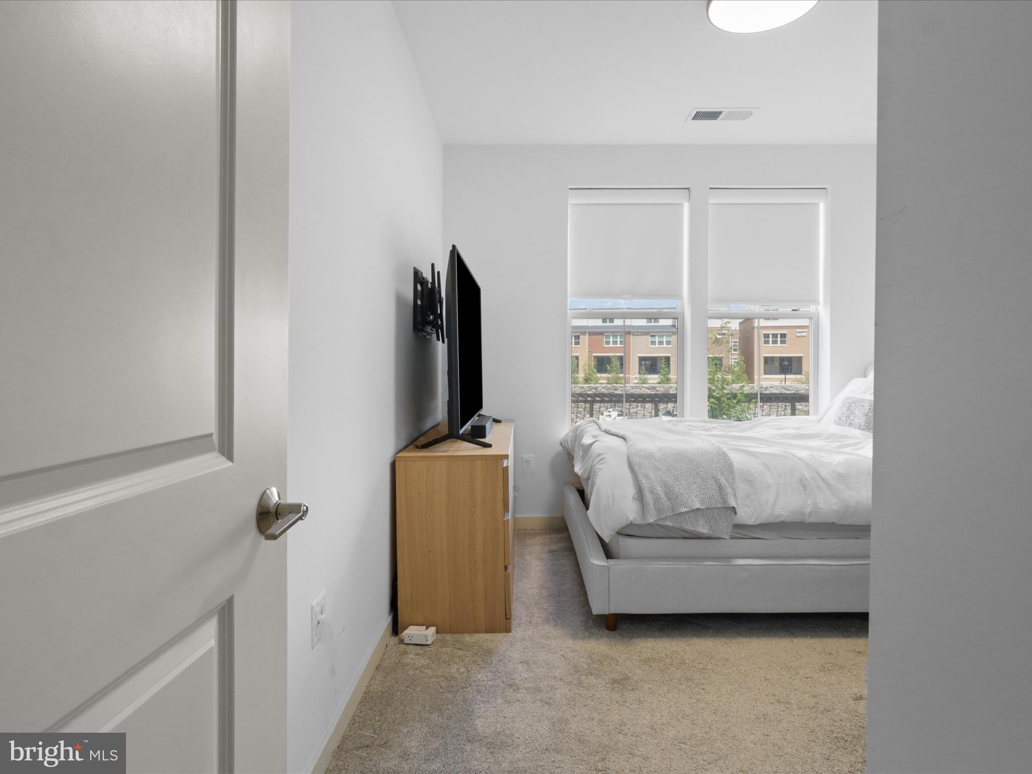 10755 Fairgrounds Drive, Unit 223 Fairfax, VA 22030 - Photo 20 of 28 a bedroom with bed and a window