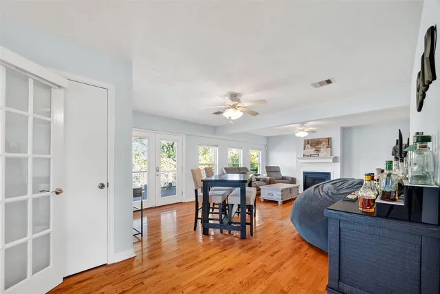 a view of a dining room with furniture window and wooden floor