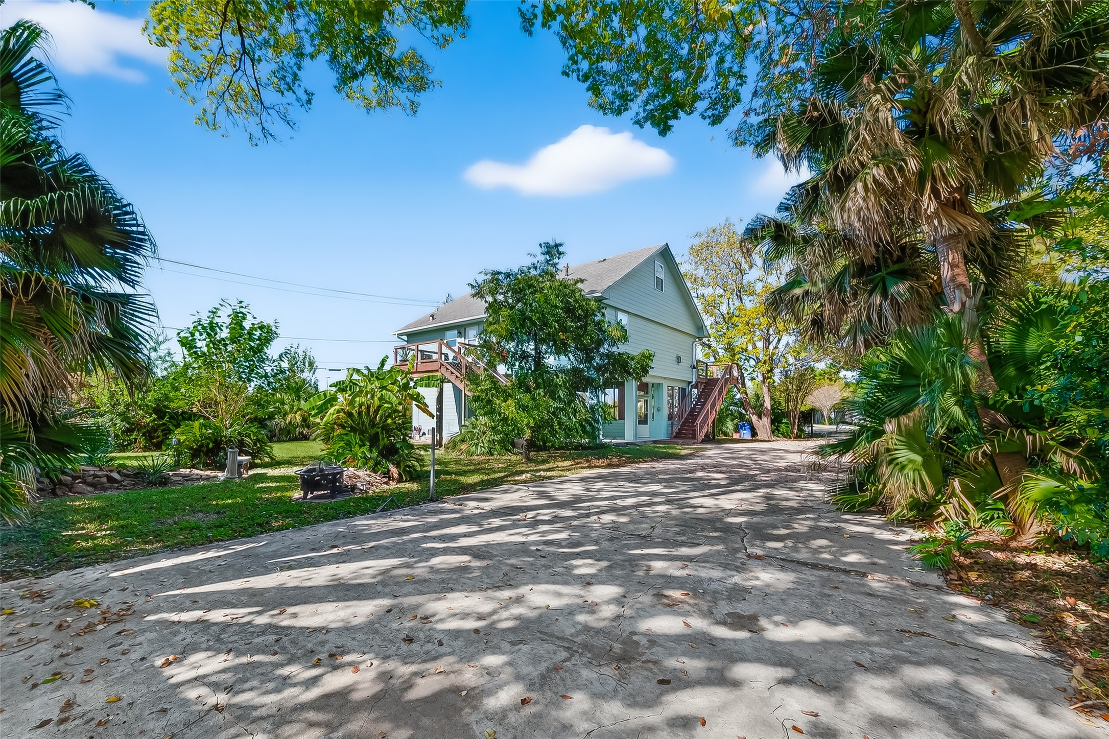 180 Grove Road Kemah, TX 77565 - Photo 2 of 50 a view of a yard with plants and trees