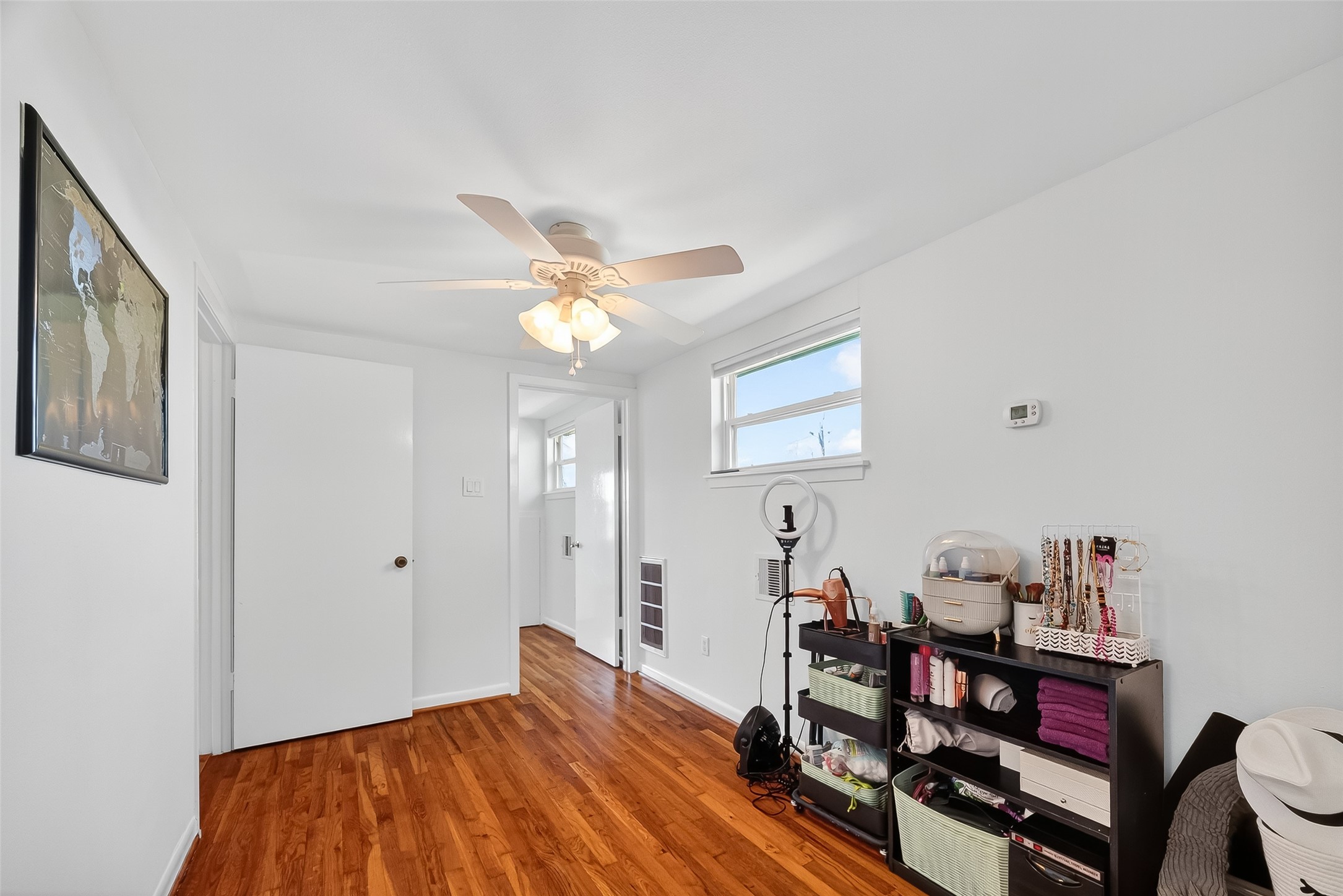 180 Grove Road Kemah, TX 77565 - Photo 25 of 50 a bedroom with a bed and a chandelier