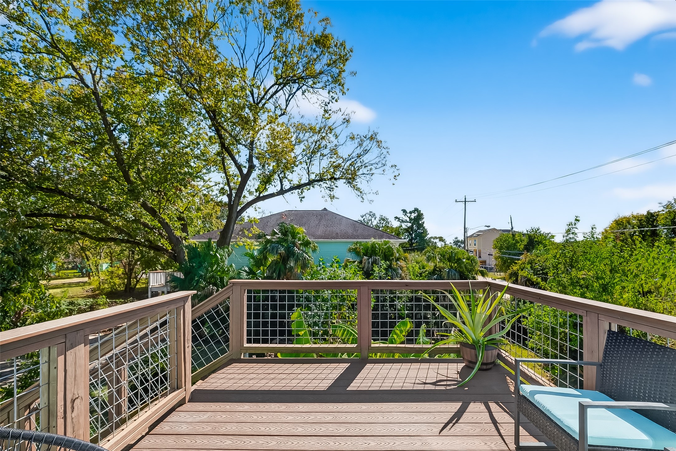 180 Grove Road Kemah, TX 77565 - Photo 38 of 50 a view of a wooden deck next to a yard