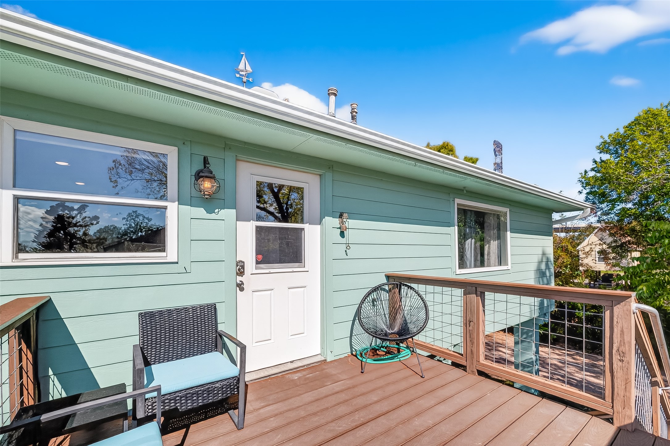 180 Grove Road Kemah, TX 77565 - Photo 39 of 50 a front view of a house with wooden deck and furniture
