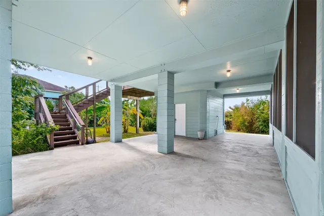 a view of a porch with wooden floor and outdoor space