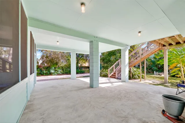 a view of a house with porch and garden