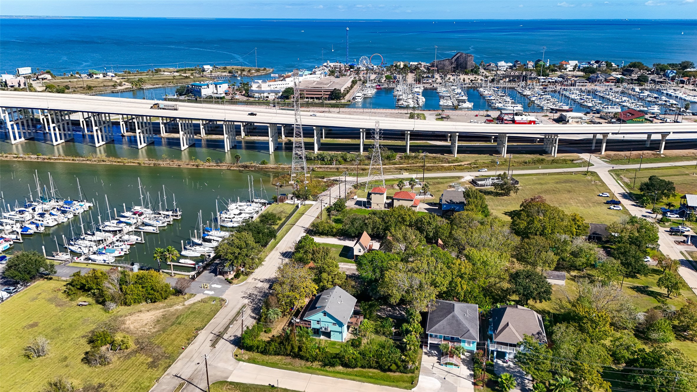 180 Grove Road Kemah, TX 77565 - Photo 50 of 50 a view of a lake with a city skyline in the background