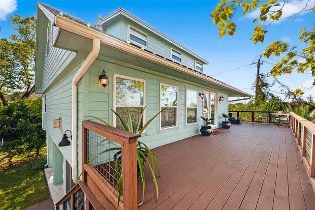 a view of a house with wooden deck