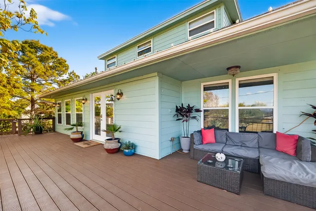 a living room with furniture and flowers