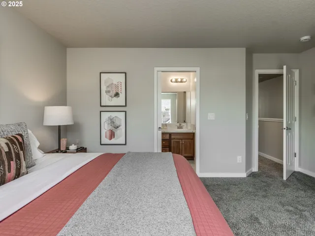 a bathroom with a shower sink vanity and mirror