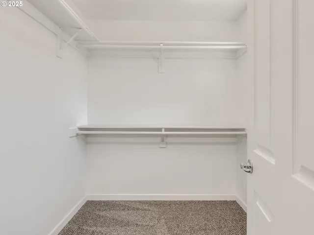 a front view of a house with a wooden fence