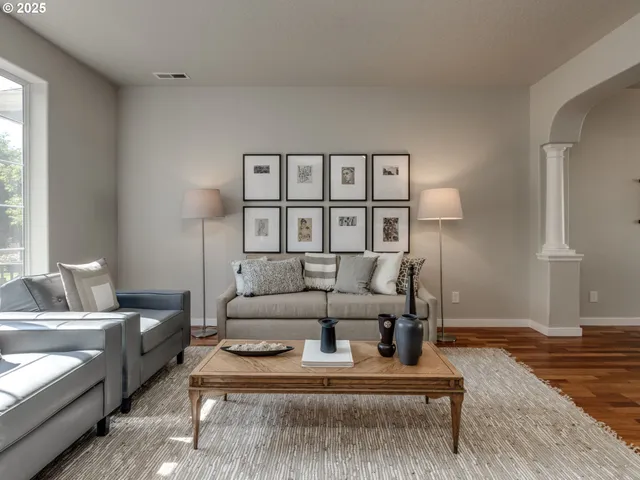 a living room with furniture and a lamp