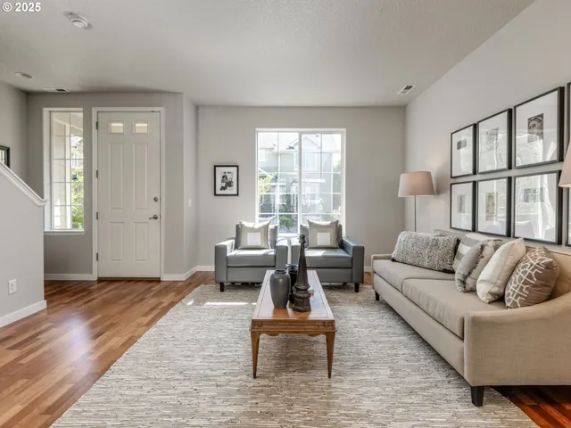a living room with furniture and a table