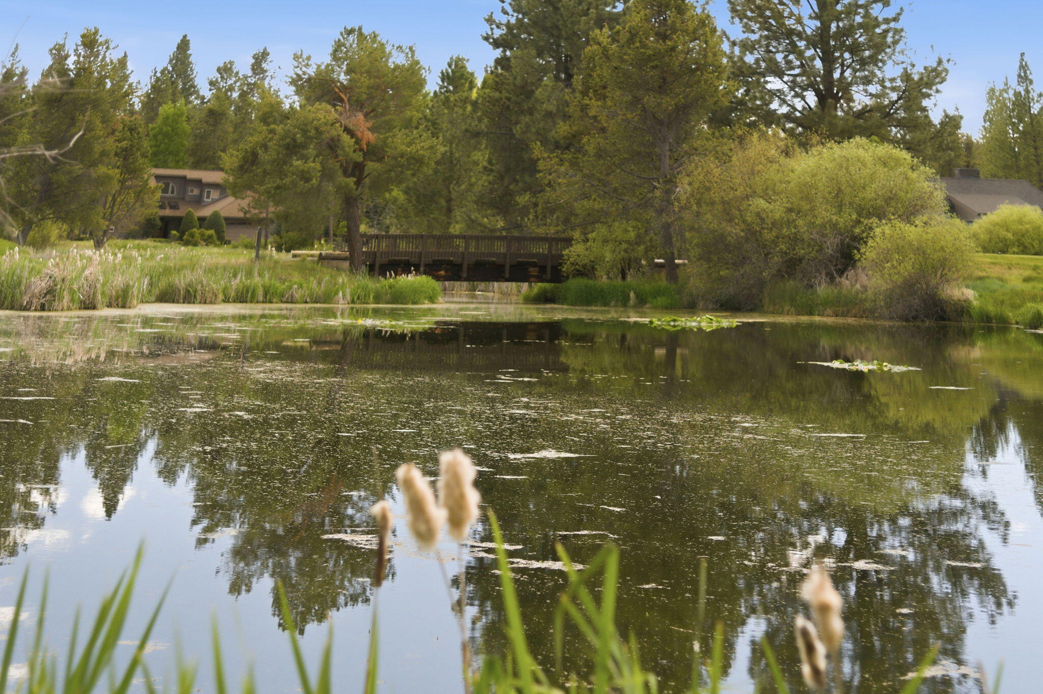 17654 Pinnacle Lane, Unit 16 Sunriver, OR 97707 - Photo 21 of 28 a view of a lake in between two chairs