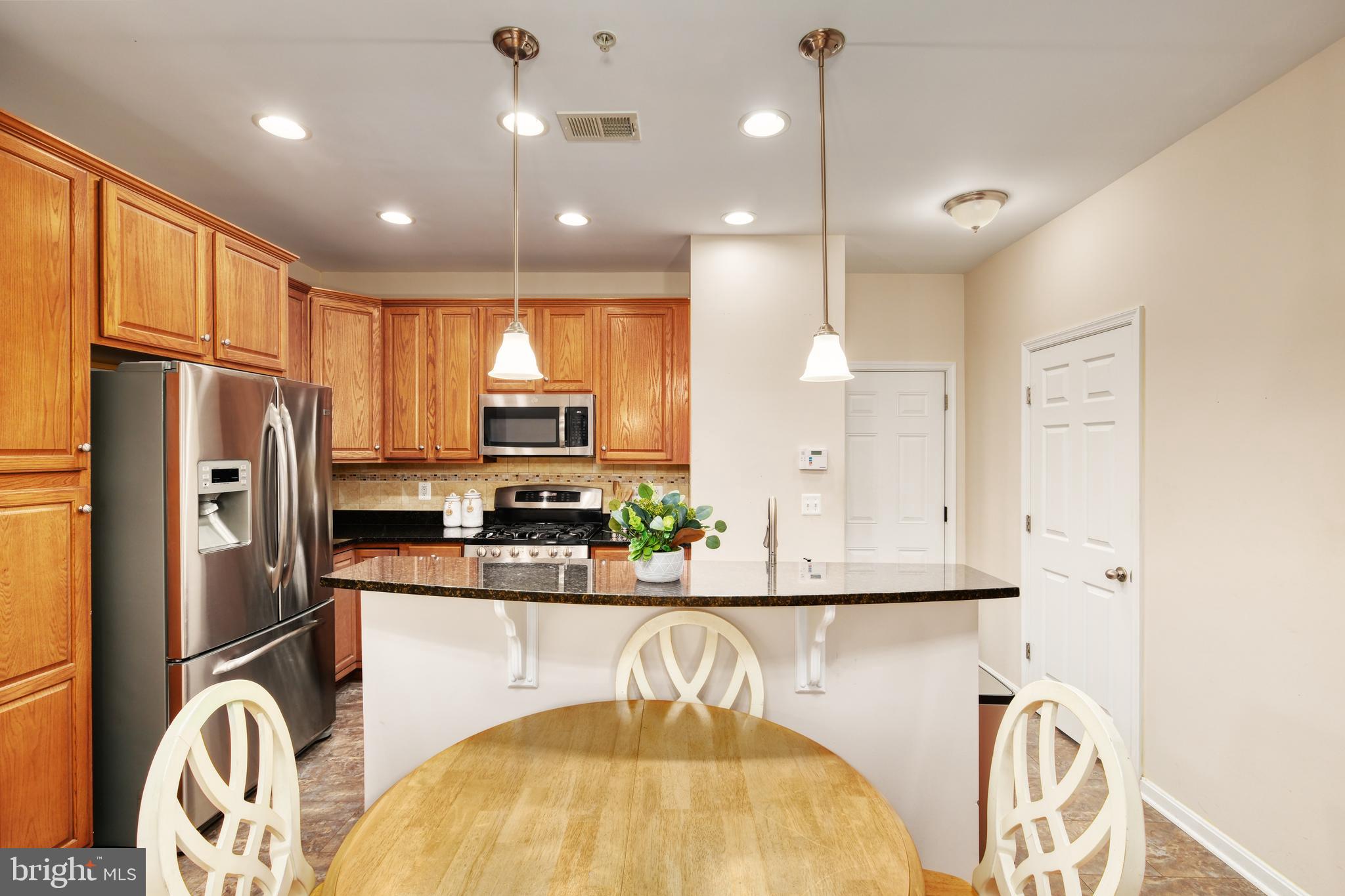 9583 Center Street Manassas, VA 20110 - Photo 16 of 34 Put your dining table here, or pull up stools!