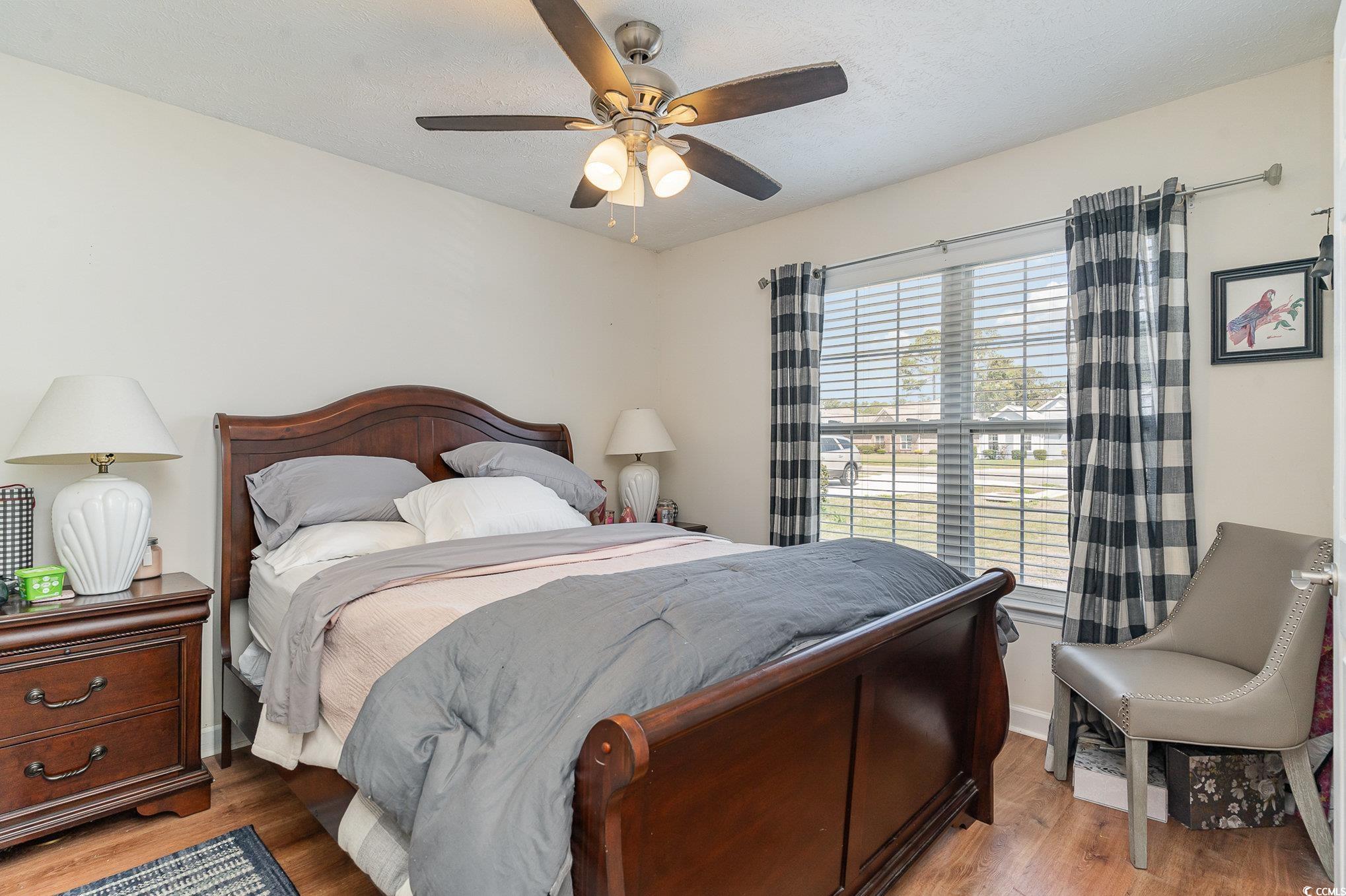 650 Bucks Trail Longs, SC 29568 - Photo 16 of 30 Bedroom with a textured ceiling, wood finished flo