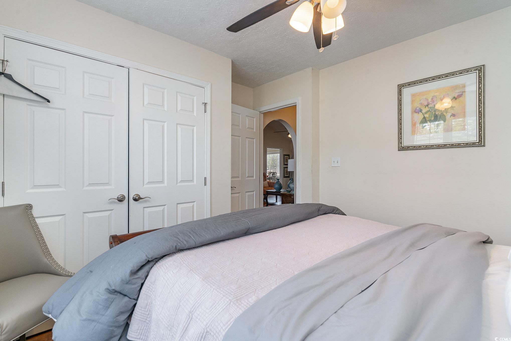 650 Bucks Trail Longs, SC 29568 - Photo 18 of 30 Bedroom featuring a closet, arched walkways, a tex