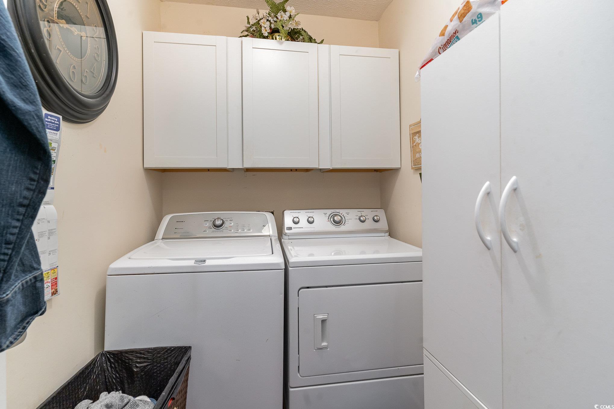 650 Bucks Trail Longs, SC 29568 - Photo 22 of 30 Washroom with cabinet space and washer and clothes
