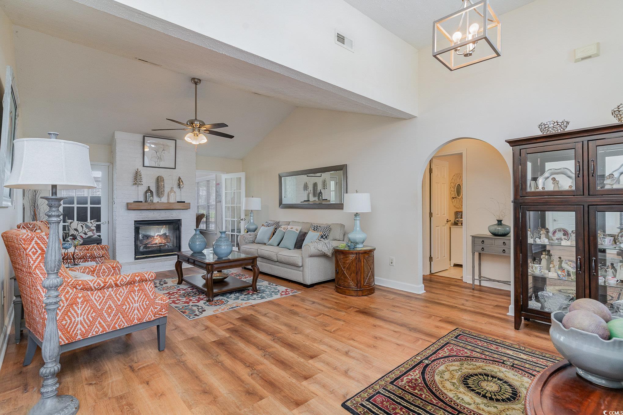 650 Bucks Trail Longs, SC 29568 - Photo 3 of 30 Living area with high vaulted ceiling, light wood-