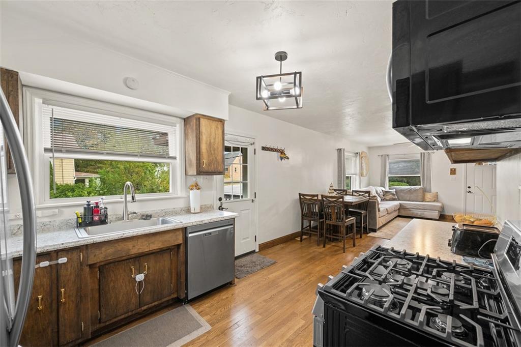 1199 Marshall Road Monaca, PA 15061 - Photo 15 of 46 a kitchen with a stove a sink and a window