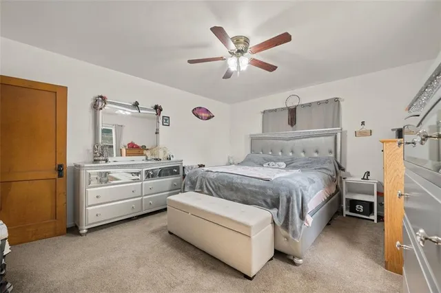 a bedroom with a bed and cabinets