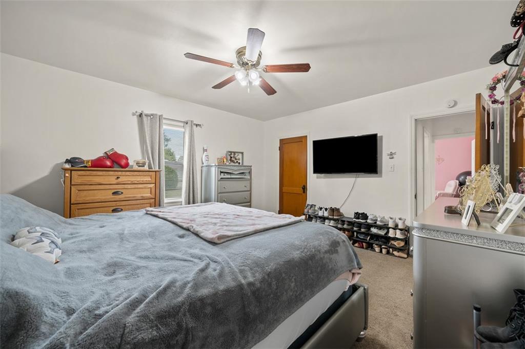 1199 Marshall Road Monaca, PA 15061 - Photo 19 of 46 a bedroom with a bed and a flat screen tv