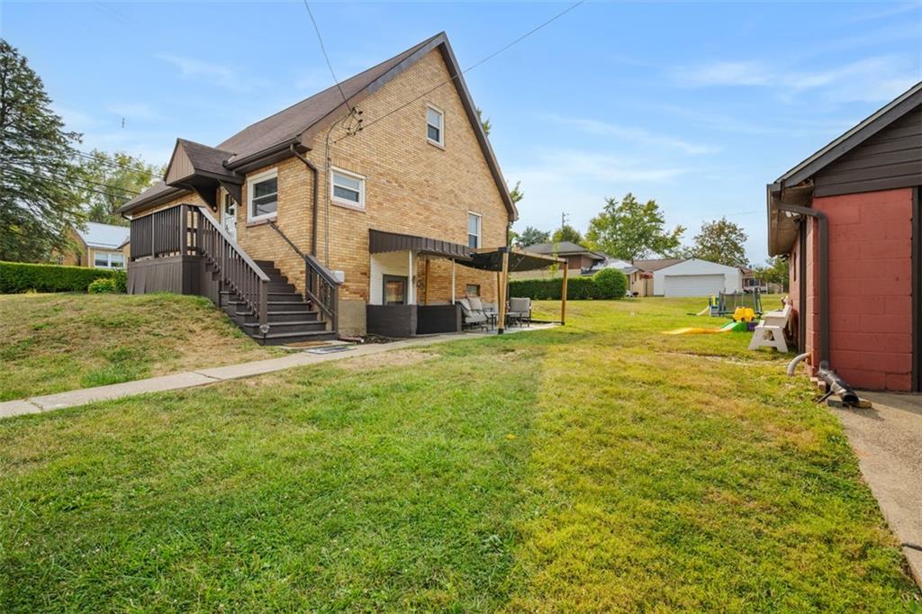 1199 Marshall Road Monaca, PA 15061 - Photo 39 of 46 a view of a house with a big yard and potted plants