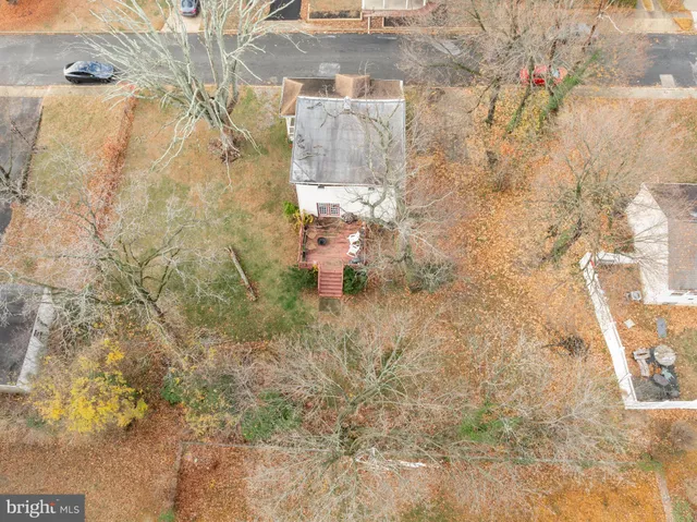 a backyard of a house with yard and outdoor seating