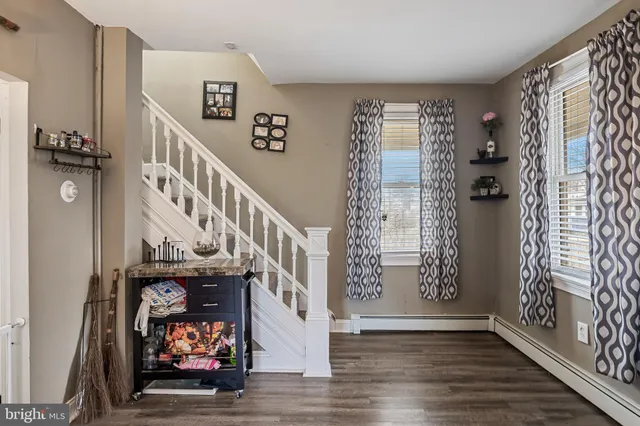a view of an entryway with wooden floor