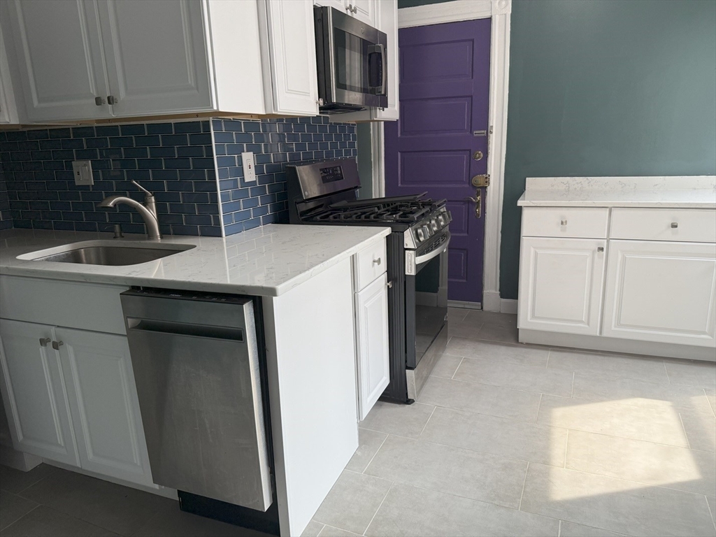 36 Orkney Road, Unit 3 Boston, MA 02135 - Photo 5 of 11 a kitchen with a sink and cabinets