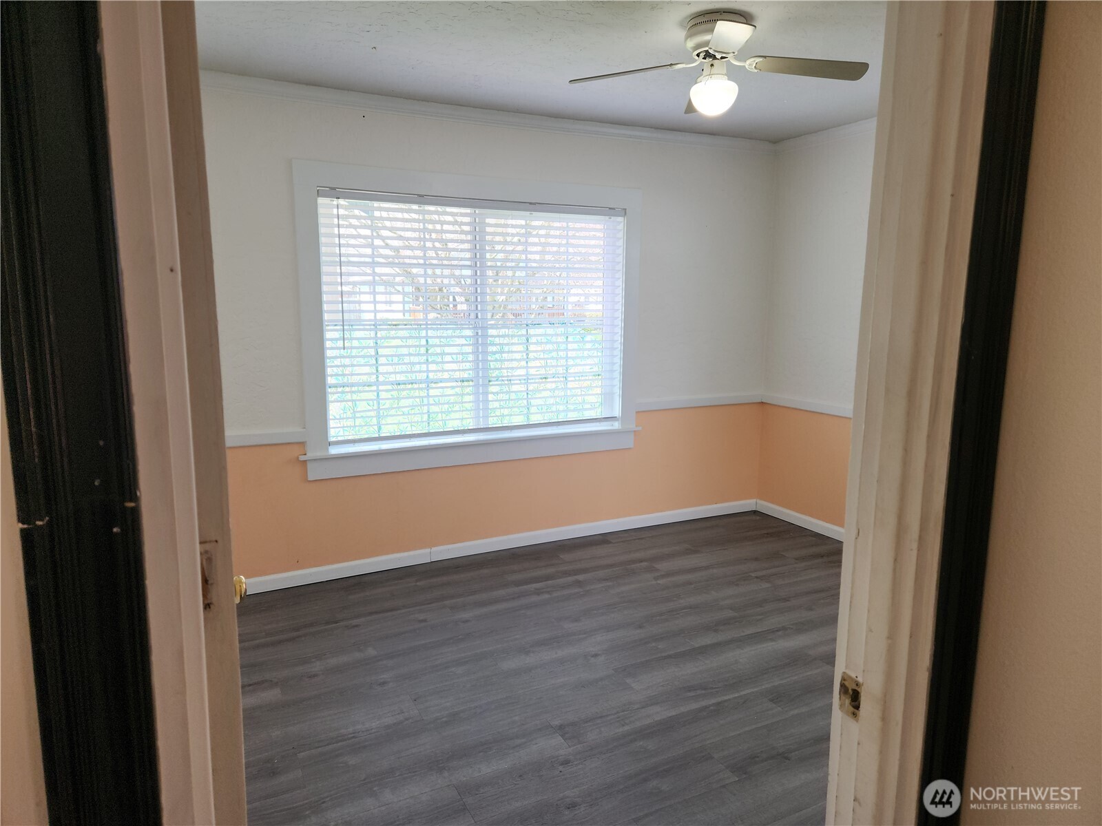 2902 Dover Street Longview, WA 98632 - Photo 20 of 23 a view of an empty room with wooden floor and a window
