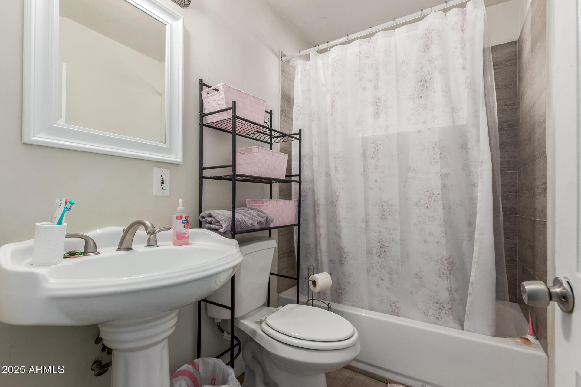 2752 West Royal Palm Road Phoenix, AZ 85051 - Photo 19 of 23 a bathroom with a sink toilet and shower